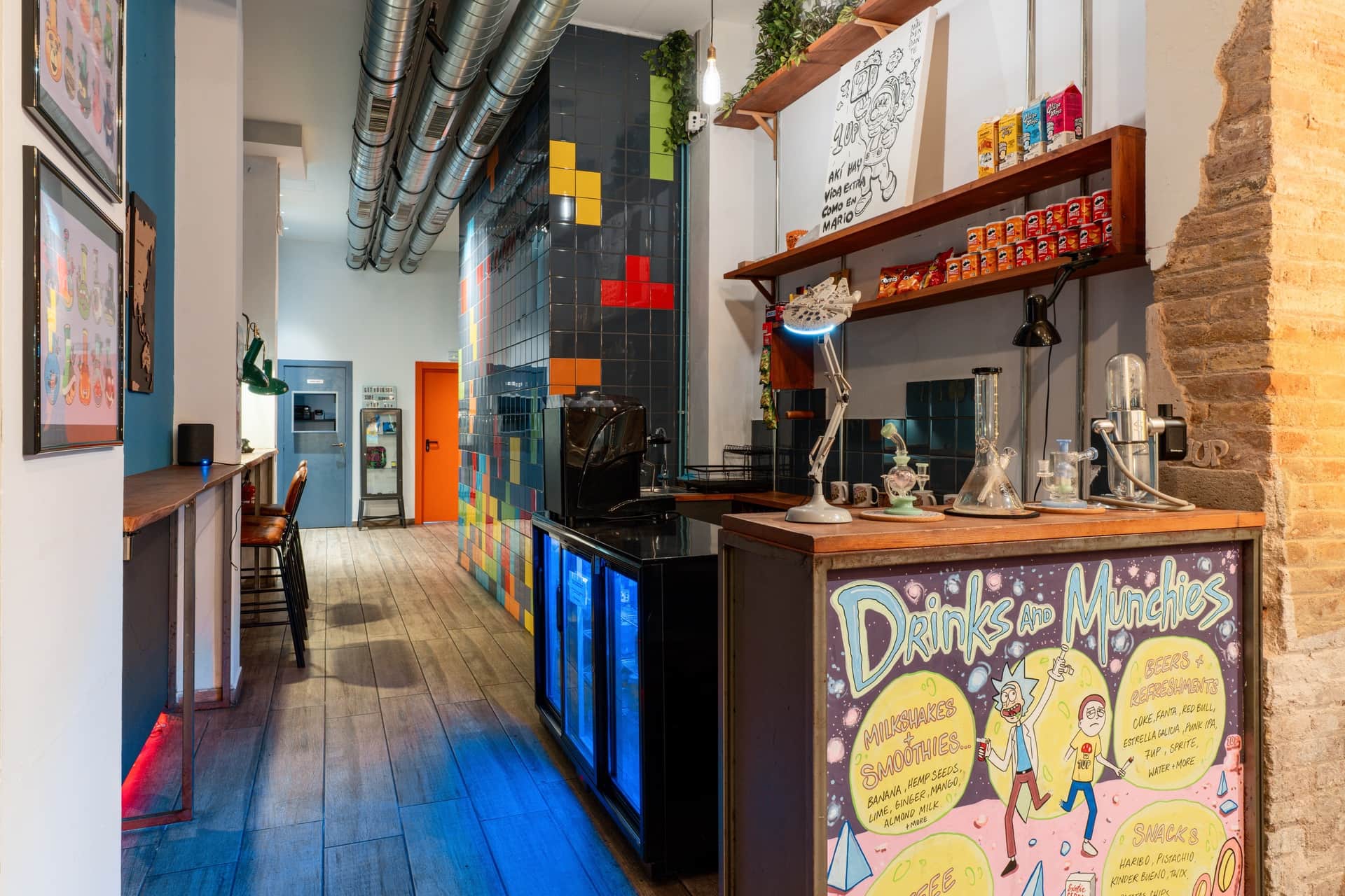 Bar counter and vibrant interior of social cannabis club 1UP in Barcelona