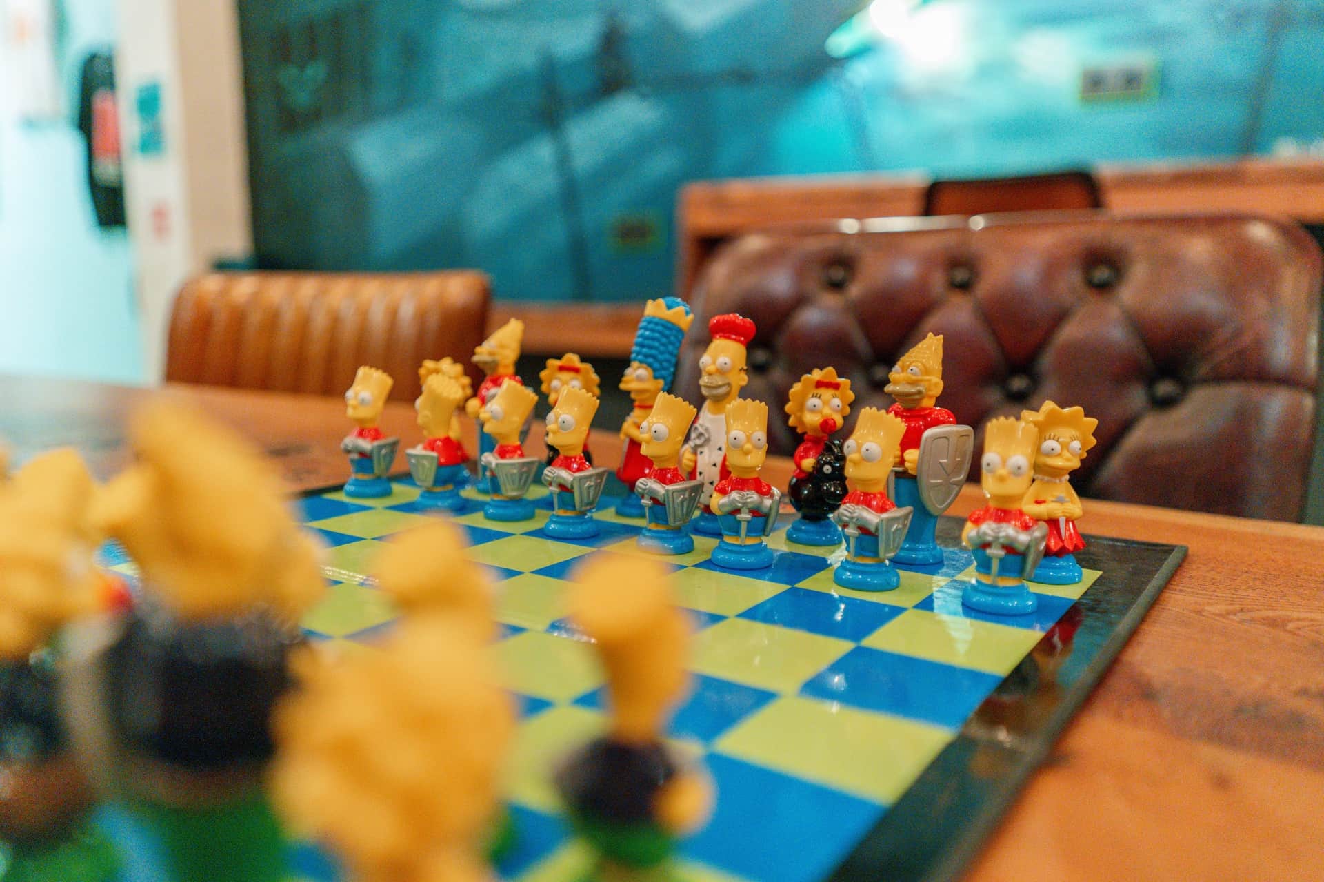 Board games and Simpsons chess set at cannabis association 1UP Barcelona